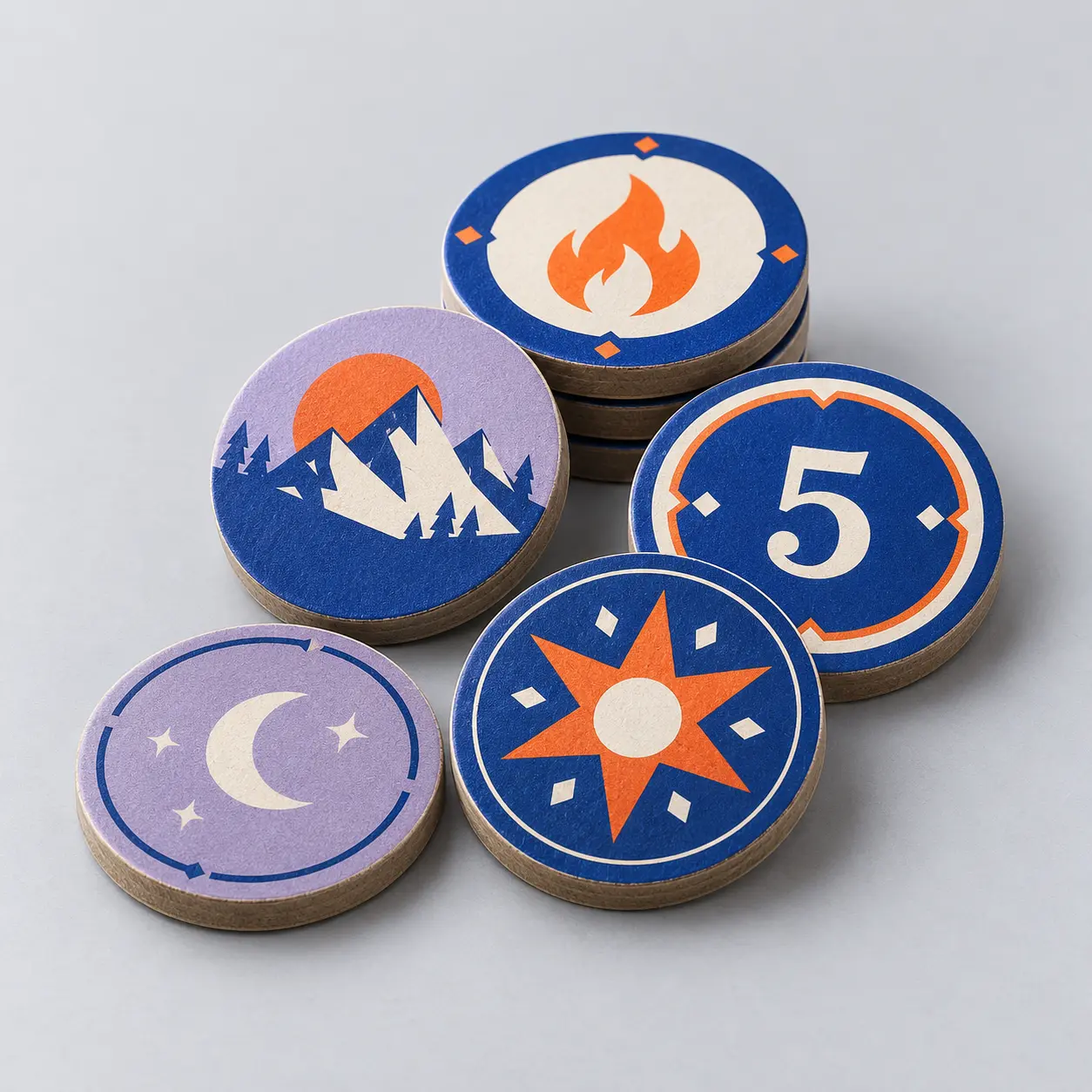 Illustrative custom round cardboard tokens with original example artwork; made-to-order production